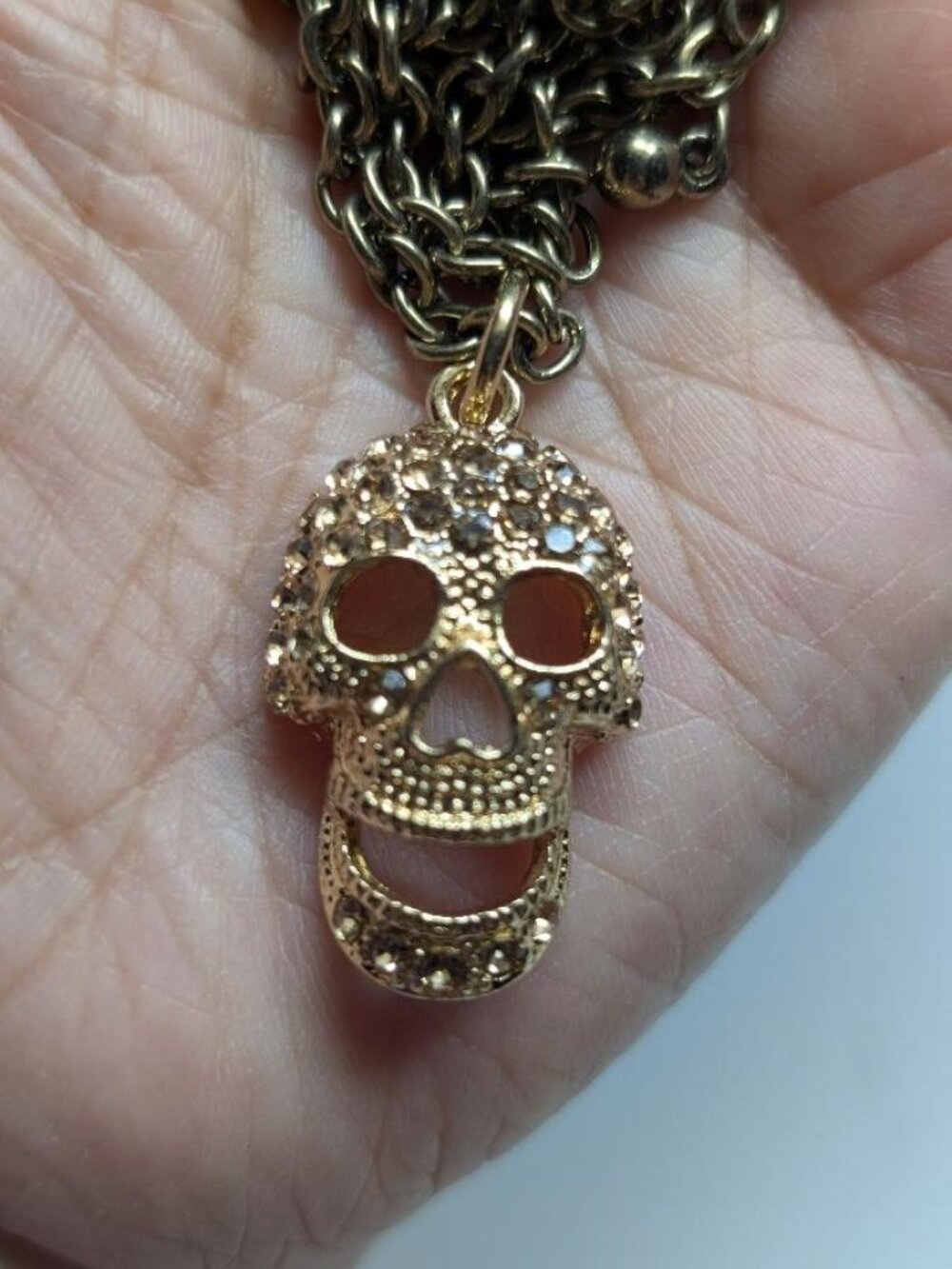 Vintage Halloween Gold Tone Skull with Rhinestones Pendant Necklace.